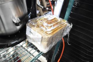 Amber poly 1/6 size drop-in bin lids, brand new with minor scratches and dents, in packaging with label showing quantity 146.
