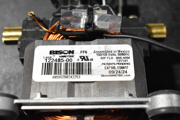 Bison 122485-00 motor, brand new, scratch and dent, assembled in Mexico, 100/120V, label with specs and patent info visible.