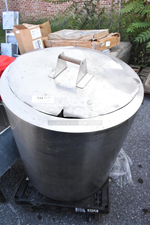 Stainless steel kettle with lid, showing surface wear. Tag reads "334." Ideal for industrial use.