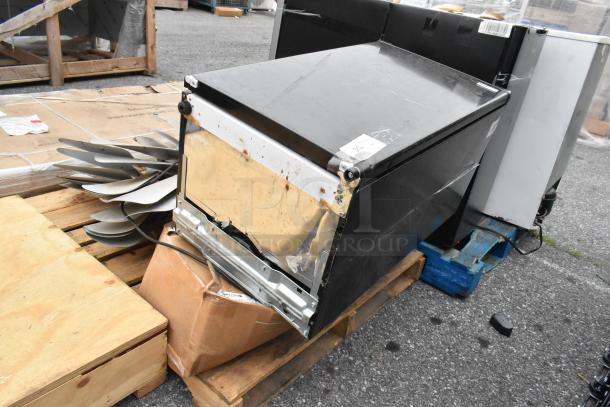 Image shows assorted auction items on pallets, including Igloo IRF32BK mini cooler, metal fan blades, and plastic strip curtain rolls. Items appear used.