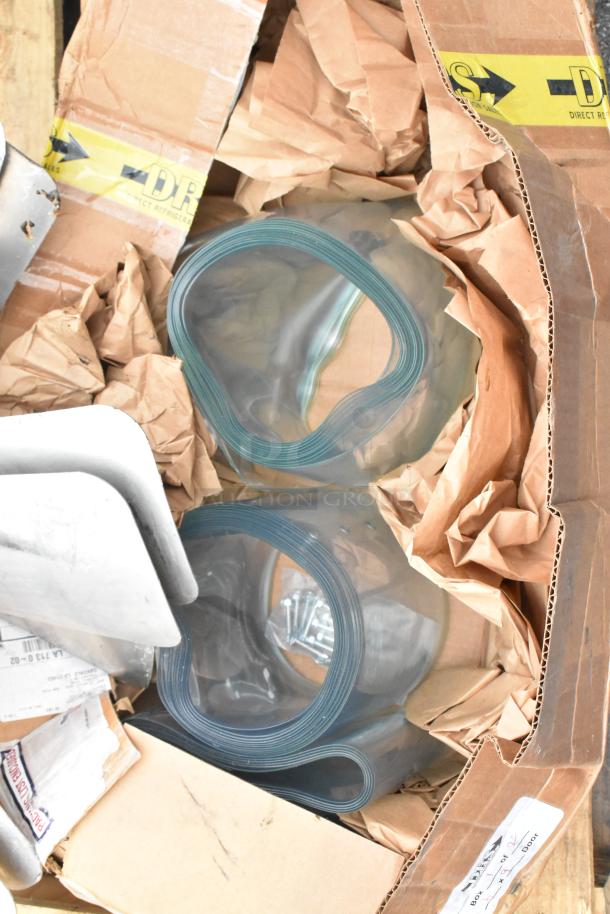 Box containing Igloo IRF32BK Mini Cooler, metal fan blades, plastic strip curtain rolls. Items in used condition.