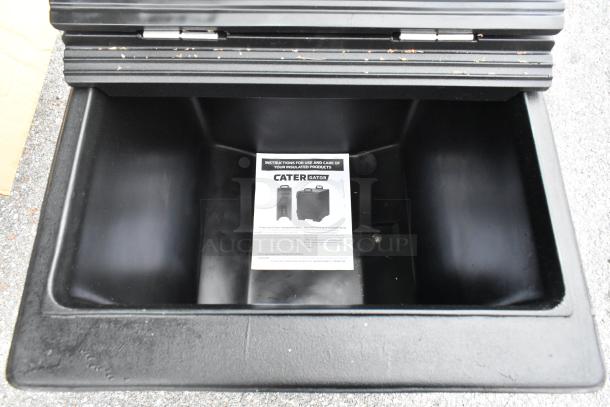 BRAND NEW CaterGator 215IB125BK 125 lb. black mobile ice bin with flip lid, scratch and dent condition. Instructions visible inside.