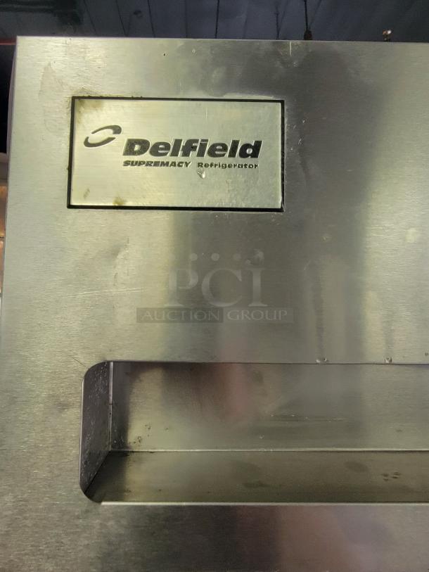 Delfield & Perlick SRPT1-G pass-through commercial refrigerator. Features visible Delfield branding. Ideal for busy kitchens.