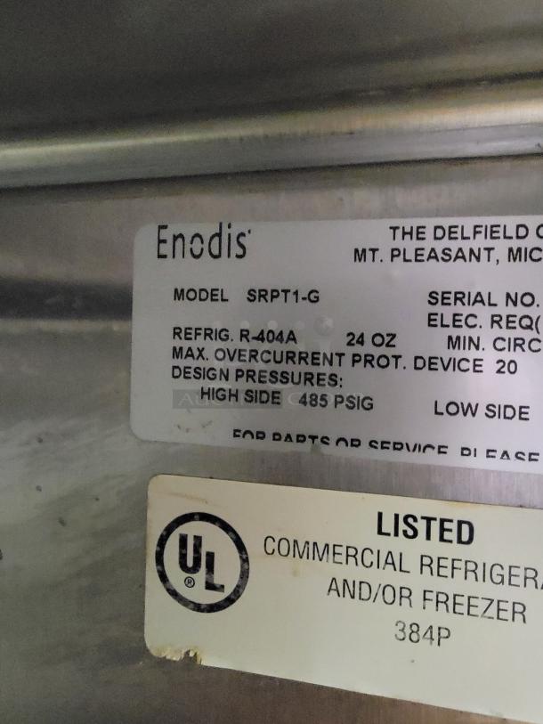 Delfield & Perlick SRPT1-G pass-through commercial refrigerator label, showing model, R-404A refrigerant, and UL listing.
