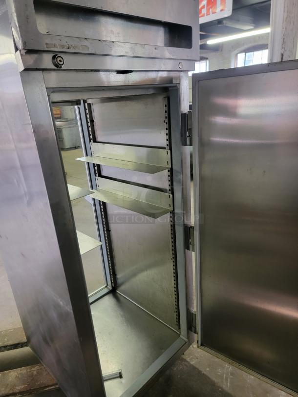 Delfield & Perlick SRPT1-G pass-through commercial refrigerator, open door, metal shelves, suitable for restaurants.