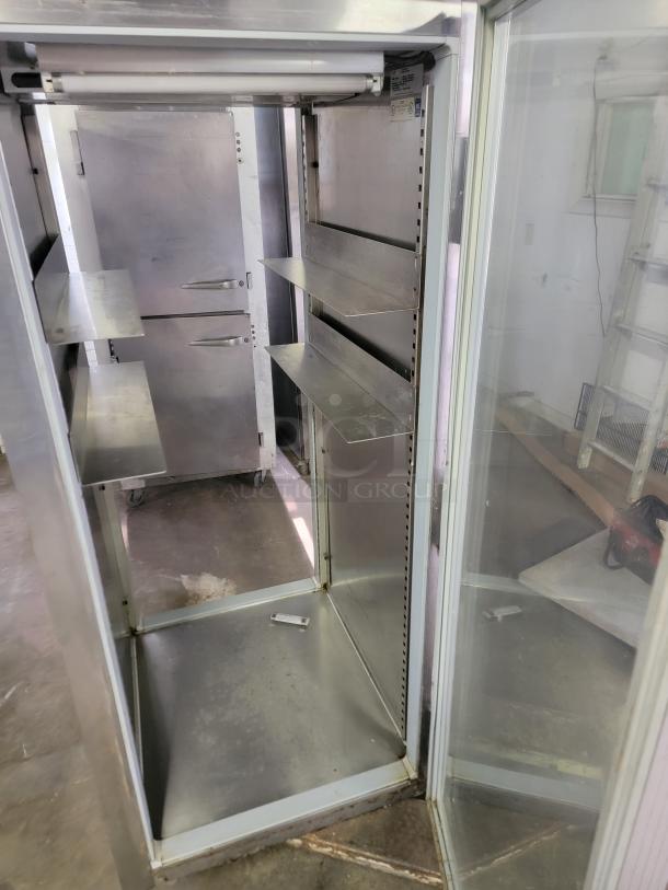 Delfield & Perlick SRPT1-G pass-through commercial refrigerator, stainless steel, shelves included, ideal for restaurants, visible wear.