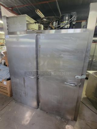 Traulsen two-door pass-through refrigerator, model AR1-2-32 LPUT. Sturdy stainless steel, ideal for high-traffic kitchens.