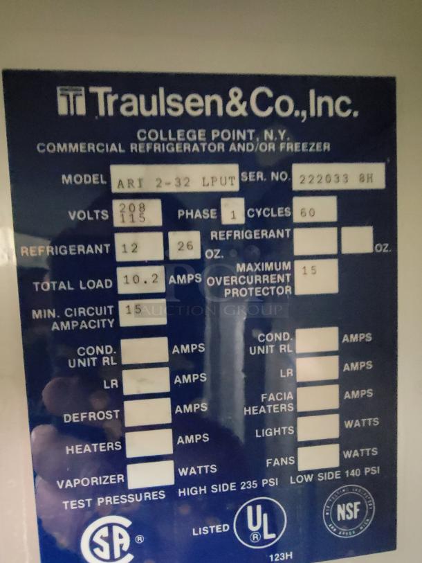 Traulsen AR1-2-32 LPUT pass-through refrigerator label showing model, refrigerant levels, voltage, and certifications.
