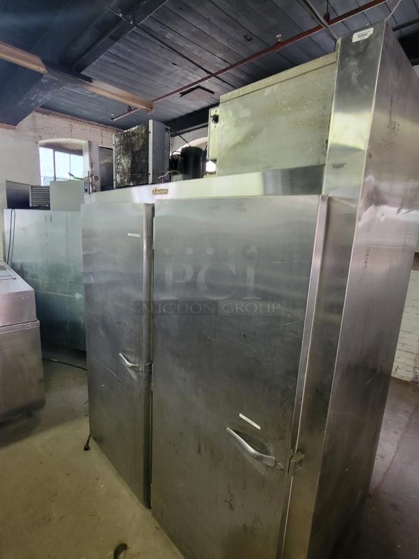 Traulsen two-door pass-through refrigerator, model AR1-2-32 LPUT. Stainless steel, commercial-grade, used condition.