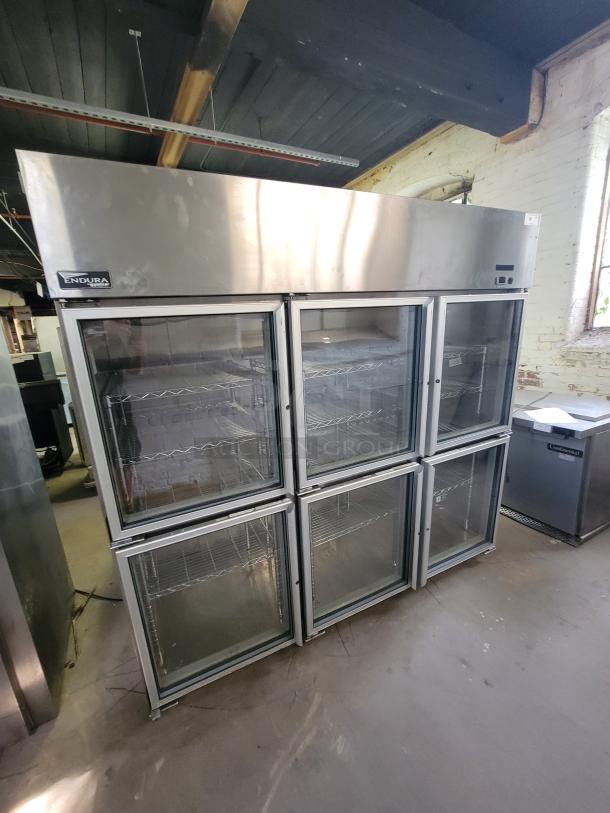 Master-Bilt Endura 6-Door Commercial Refrigerator, Model MNR806SSG/0, with metal racks, excellent for large storage.