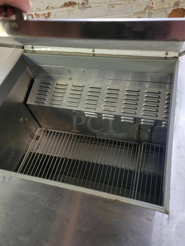 Continental SW72-30M refrigerated prep table, 6' length, open top view, metal interior, wire shelving, commercial use.
