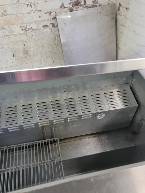Continental SW72-30M refrigerated prep table, 6', stainless steel, commercial-grade, visible wear, ideal for foodservice use.
