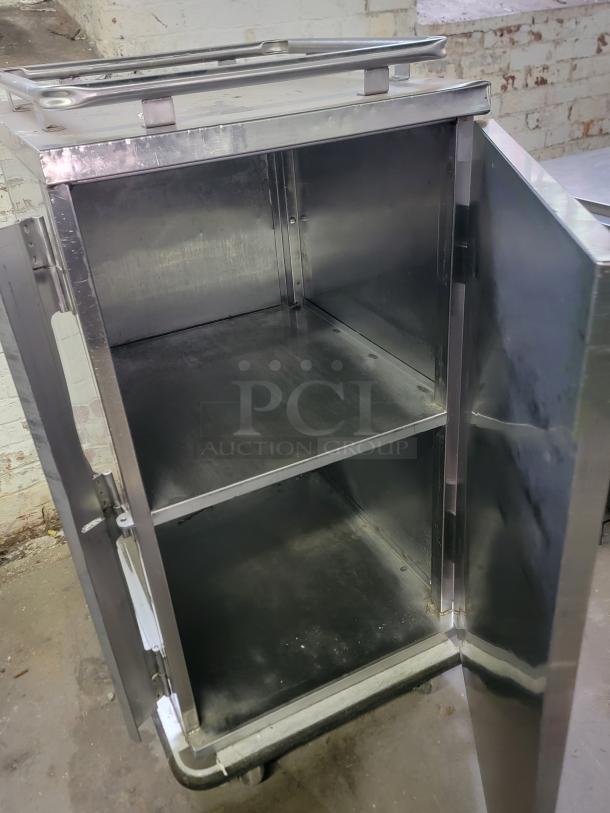 Jones Zylon ETC-UA-7 insulated meal delivery cabinet, open door view, stainless steel, used for institutional food transport.