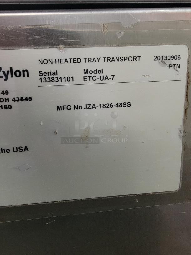 Jones Zylon ETC-UA-7 insulated meal delivery cabinet label, showing serial and model numbers. Institutional grade transport unit.