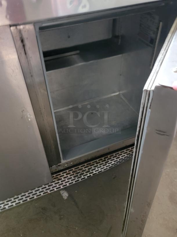 Continental SW72-30M refrigerated prep table interior, stainless steel, good condition. Suitable for commercial kitchens.