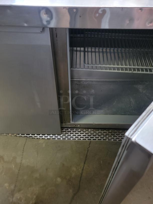 Continental SW72-30M refrigerated prep table, 6 feet, commercial-grade, stainless steel, open door showing internal shelving.