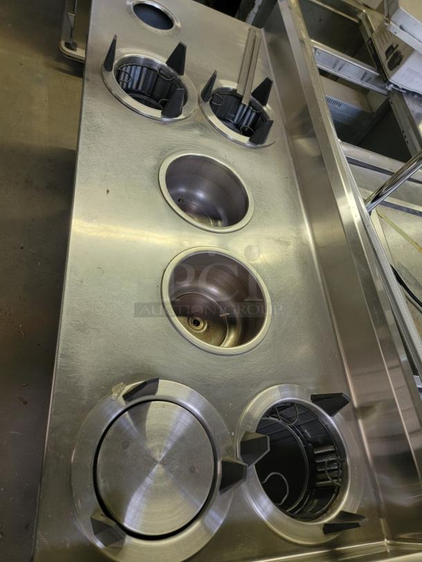 Wells SS-OULTD heated buffet table with dish warmer wells, stainless steel, in good condition. Separate heating controls visible.