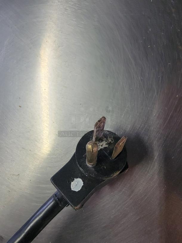 Electrical plug detail of Beverage-Air SPE72HC-30M Mega Top Prep Table, showing three-prong configuration and condition.