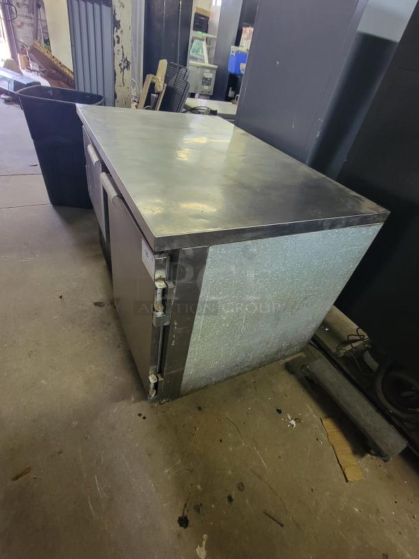 Leader LB48S/C undercounter fridge/freezer with top work surface, two refrigerated drawers, and lower door compartment. Commercial use.
