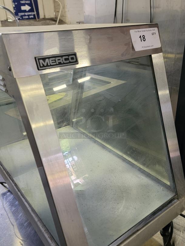 Merco 1220-1P countertop food warmer, stainless steel and glass design, adjustable heat, visible branding, auction tag present.