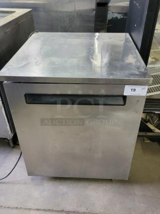 Manitowoc Delfield 436-STAR2 undercounter refrigerator, stainless steel, compact design, minor surface wear. Auction tag visible.