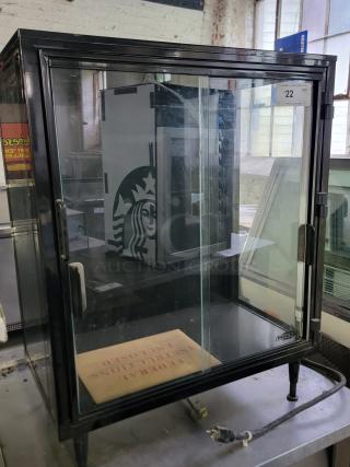 Federal Industries lighted display case model SB28SS with sleek black frame and clear glass doors. Ideal for cafes or bakeries.