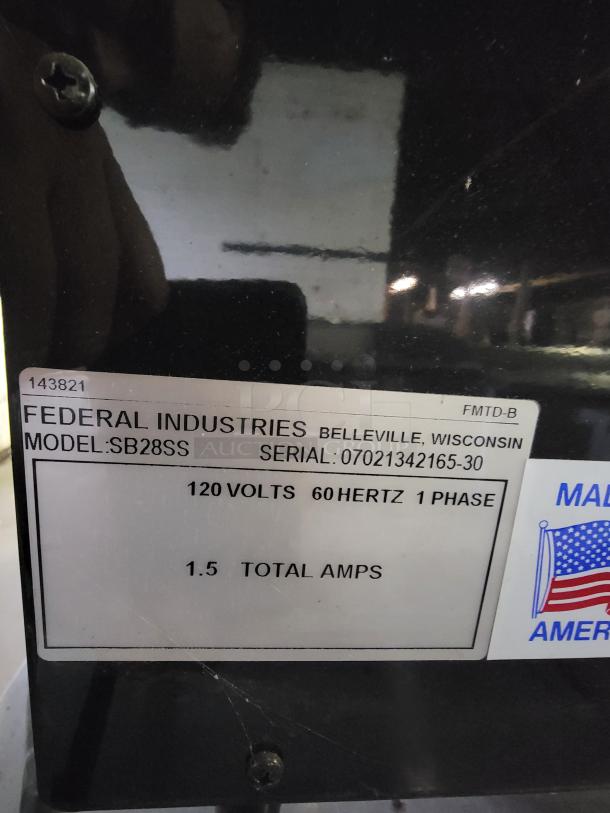 Federal Industries SB28SS lighted display case with black frame and glass doors. Label: 120V, 60Hz, 1.5A, Serial: 07021342165-30.