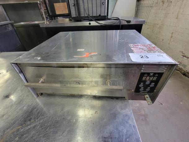 Wisco 1502 countertop oven, digital controls, missing 3 legs, scratches, fixer-upper. Auction tag visible.