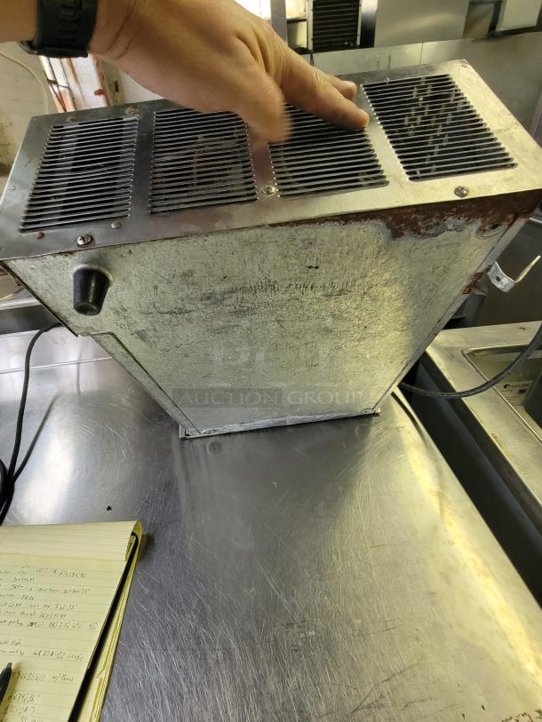 Wisco 1502 countertop oven, fixer-upper, missing 3 legs, digital controls, visible wear, project opportunity for tech-savvy buyers.
