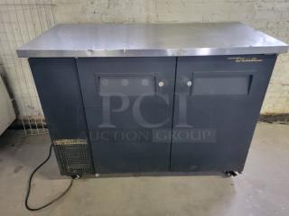 True TBB-50 Back Bar Refrigerator, black exterior with steel top, dual doors, used condition, True brand logos visible.
