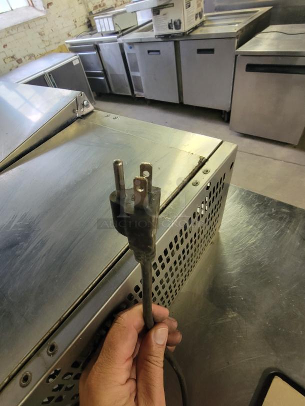 Avantco 40" refrigerated countertop prep rail, stainless steel, used condition, power cord visible, ideal for kitchens.