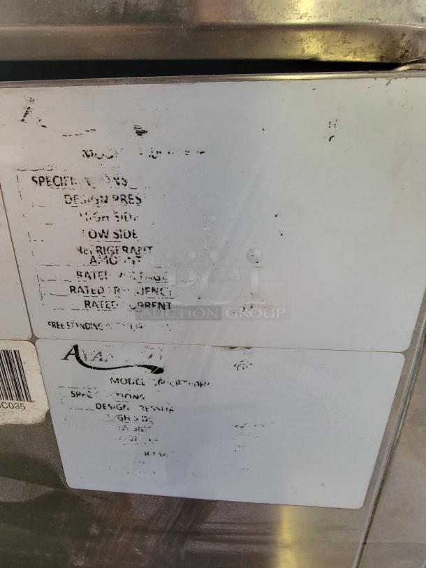 Avantco 40" refrigerated countertop prep rail, stainless steel, used, visible wear on surface, faded label information.