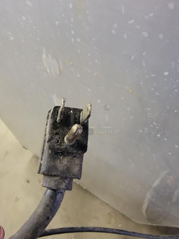Alt text: Traulsen G22010 commercial freezer plug, showing wear, suitable for restaurants and cafes.