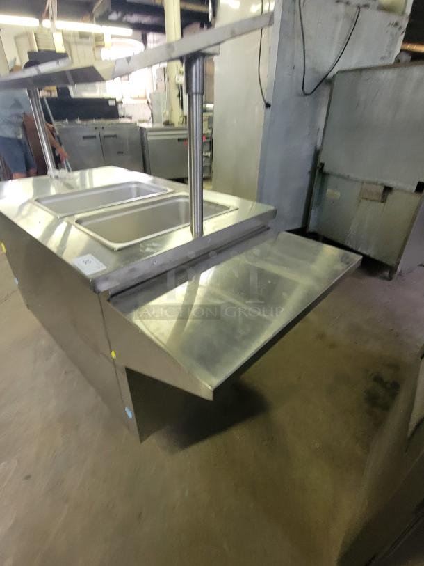 SECO SELECT BST-44 commercial mobile heated serving cart in stainless steel, featuring multiple serving trays and robust construction.