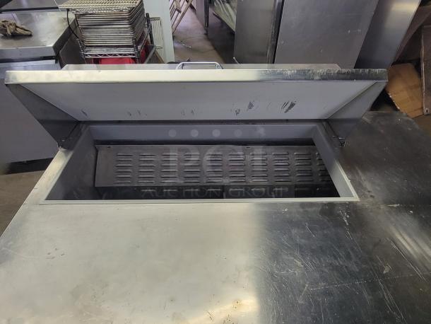 Continental SW-48-10 refrigerated prep table with drawers, open top view, stainless steel, used, for commercial kitchen use.
