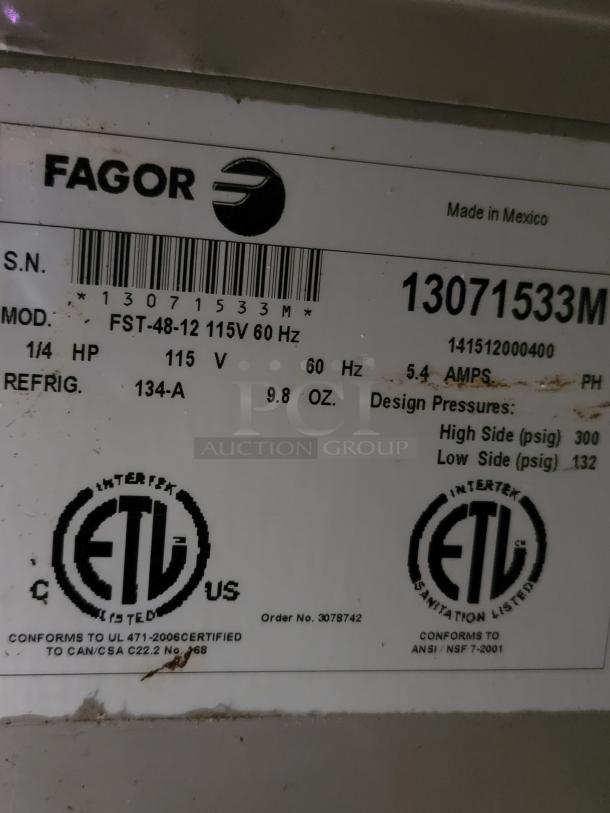 Label on Fagor FST-48-12 refrigerated prep table shows model, voltage, and certification details.