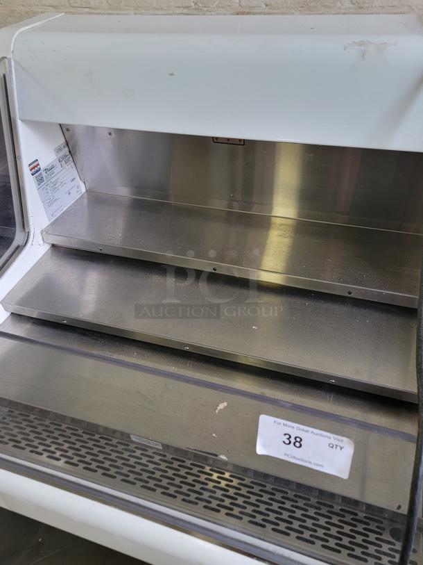 True Refrigerated Display Case, Model THAC-36, used, metal shelves, perfect for showcasing chilled foods in bakeries or cafes.