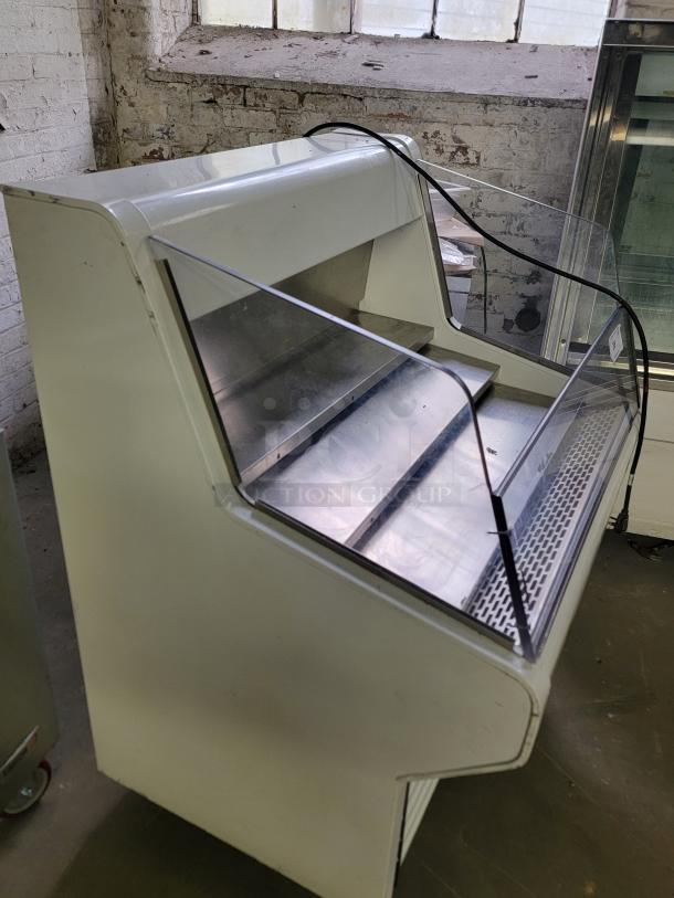 True refrigerated display case model THAC-36 in good condition, ideal for showcasing pastries and desserts.
