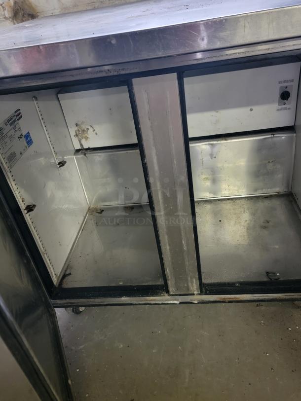True TUC-36-34 undercounter commercial refrigerator, stainless steel, moderate wear, ideal for compact kitchen spaces.