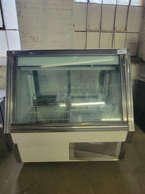 Pinnacle SC734 refrigerated display case, glass front, metal shelves, ideal for cafes. Good condition.