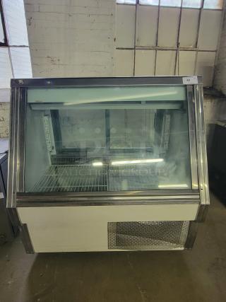 Pinnacle SC734 refrigerated display case, glass front, metal shelves, ideal for cafes. Good condition.