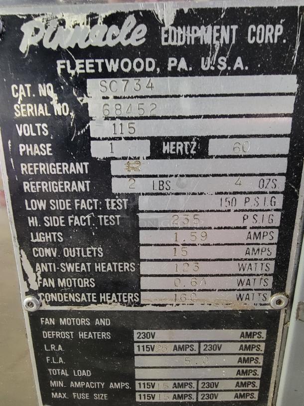 Pinnacle SC734 refrigerated display case label showing specifications; 115 volts, 1 phase, 60 hertz.