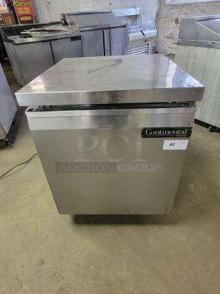 Continental SWF27 undercounter freezer, stainless steel, for commercial kitchens. Visible brand label, compact size, used condition.