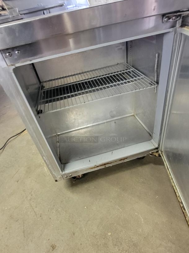Continental SWF27 undercounter freezer, stainless steel, single shelf, compact, suitable for commercial kitchens, good condition.