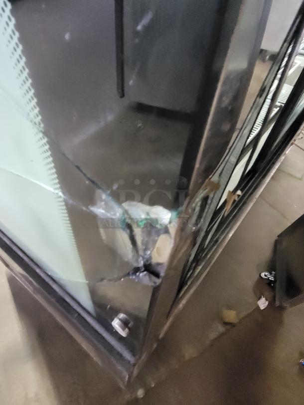 69" refrigerated display case with cracked side glass panels, requires repair. Ideal for showcasing chilled items.