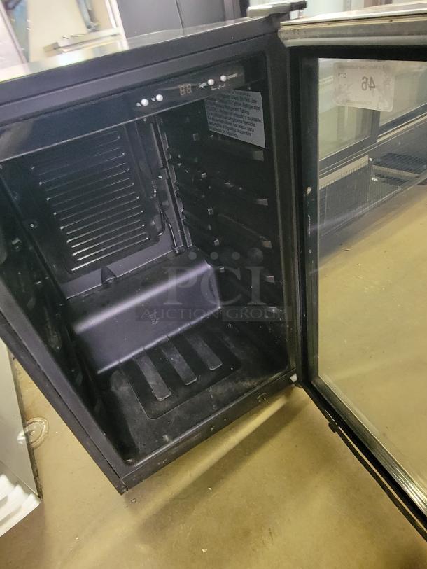 Electrolux wine chiller model FFBC4622QS-1, interior view, black finish, open door, electronic temperature controls.
