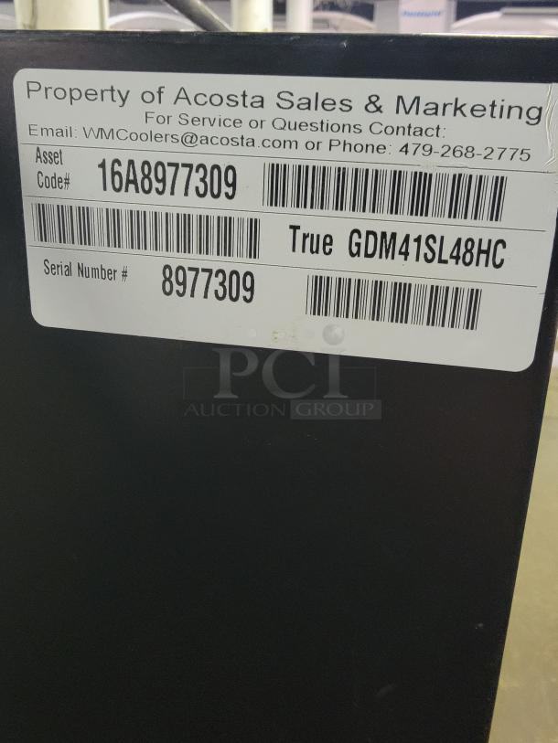 True GDM41SL48HC commercial refrigerator, two-door. Ideal for stores or bars. Asset and serial numbers visible on label.