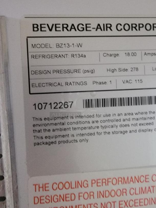Beverage-Air BZ13-1-W open-air merchandiser. Label details refrigerant R134a, design pressure 278 psig, 115 VAC.