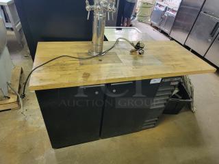 Beverage-Air BB48 kegerator with custom wooden top and multi-tap tower, ideal for home bars. Used condition.