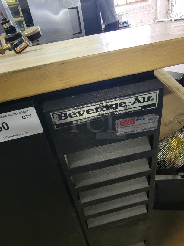 Beverage-Air BB48 kegerator with custom wooden top and multi-tap tower. Ideal for home bar or commercial use.